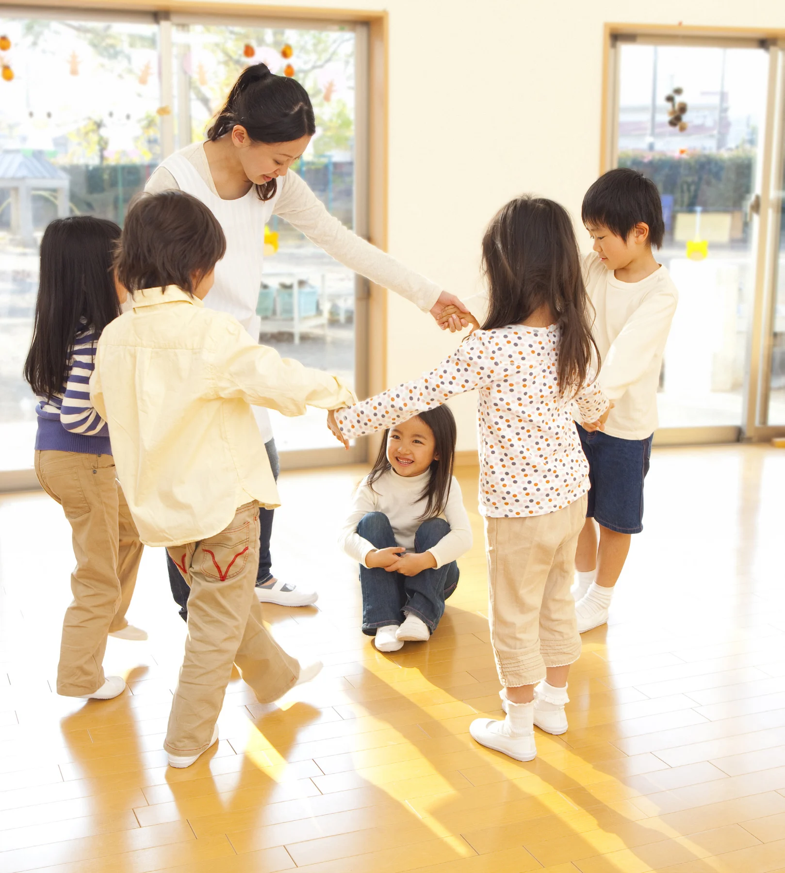 A teacher guiding children through a learning activity